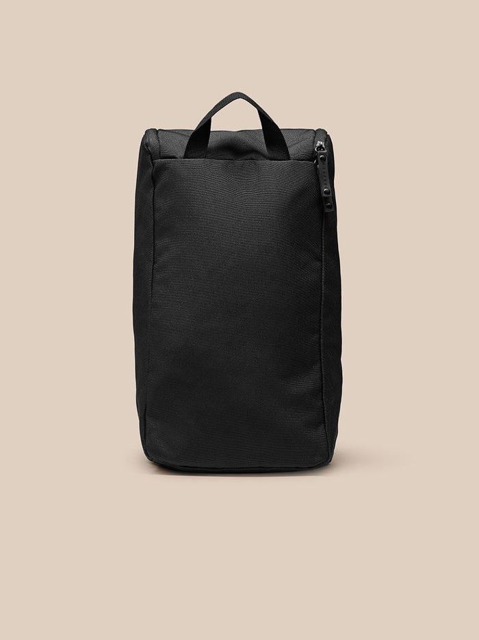Front view of black unisex boot bag with top carry handle and side zipper