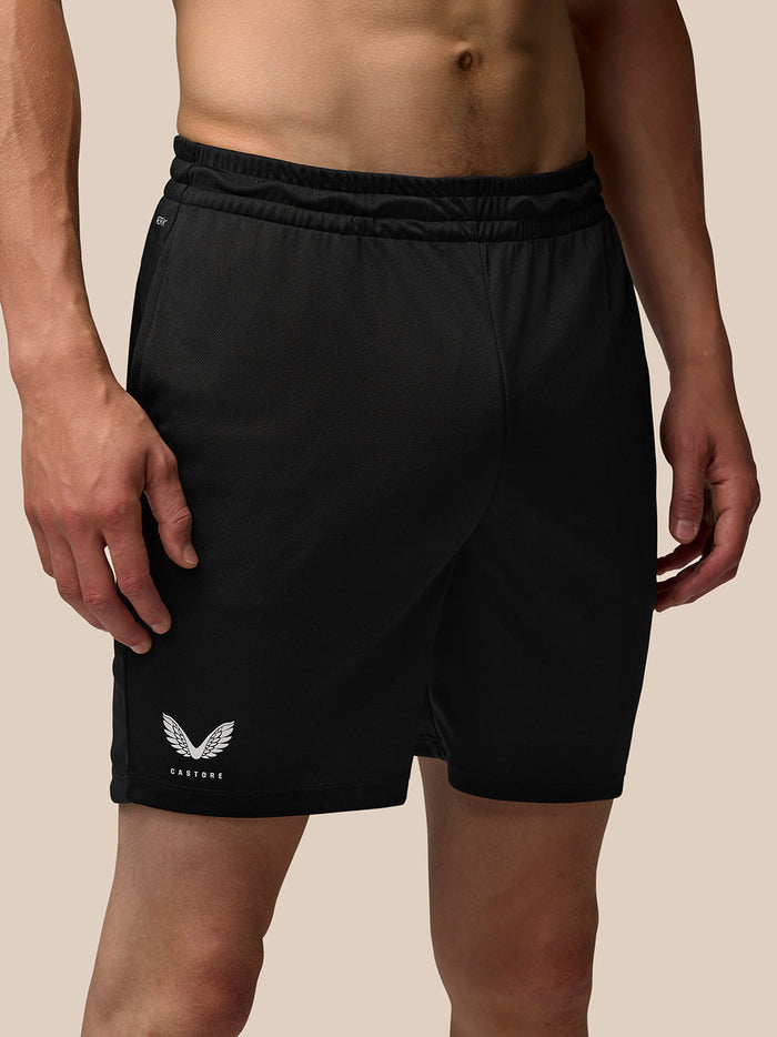 Close up of black Adapt Training 7in shorts on a model focusing on the waistband and hip area.