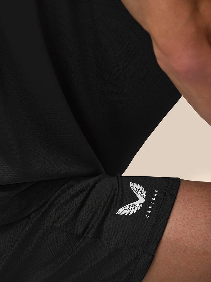 Close-up of black Adapt Training shorts with Castore logo on right thigh