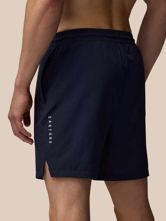 Navy shorts shown from the back with vertical Castore branding along the left leg.
