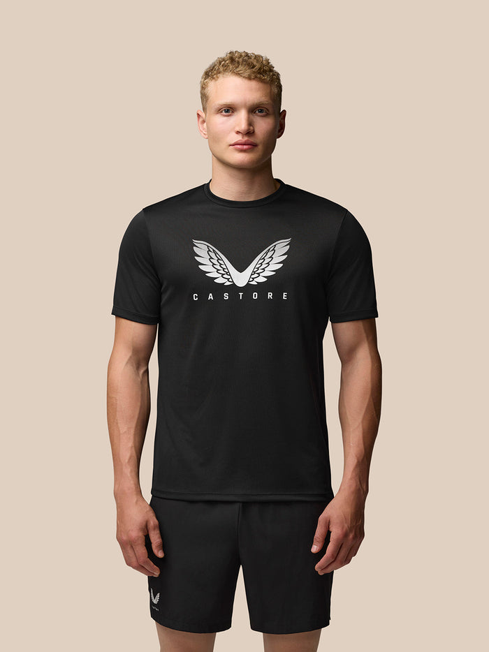 Front view of a man wearing black Adapt Training T-Shirt with Castore wings graphic on chest