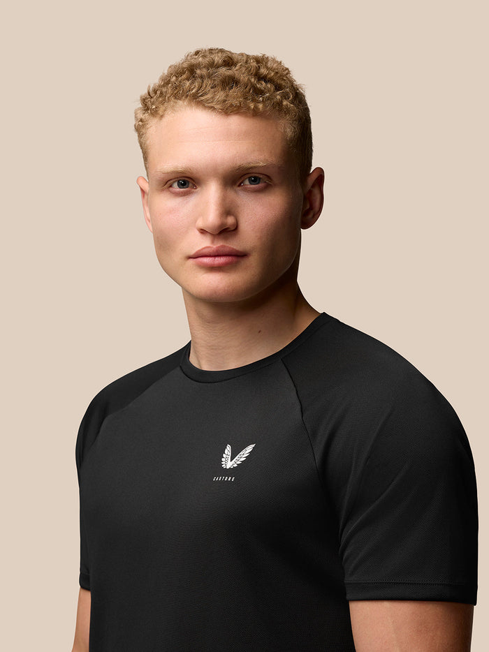 Front view of black Adapt Training T-Shirt with white Castore logo on left chest