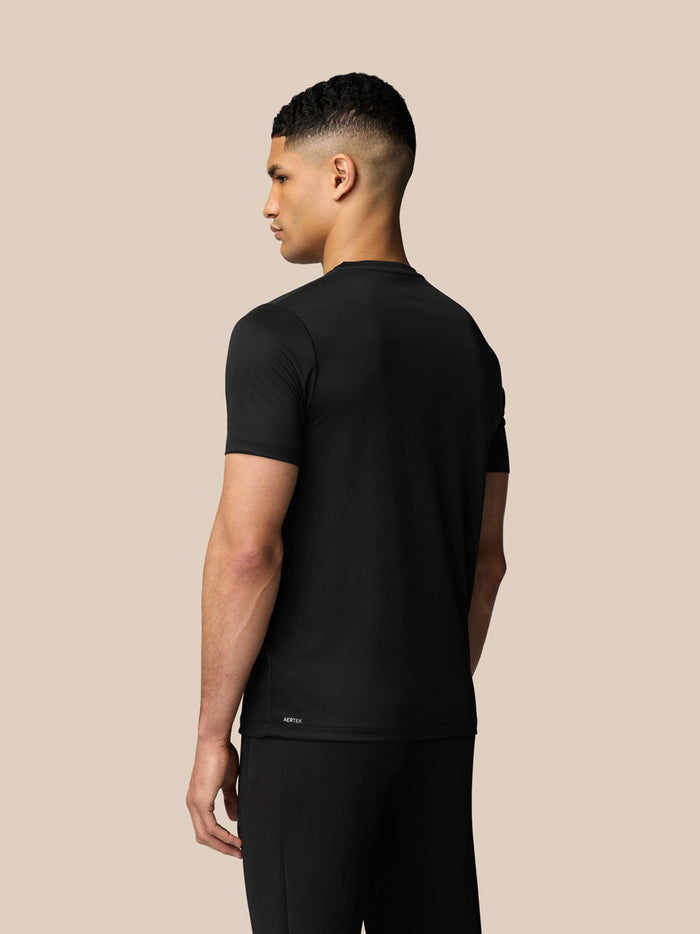 Back view of black Graphic Training T-Shirt showing Aertek branding at lower back hem