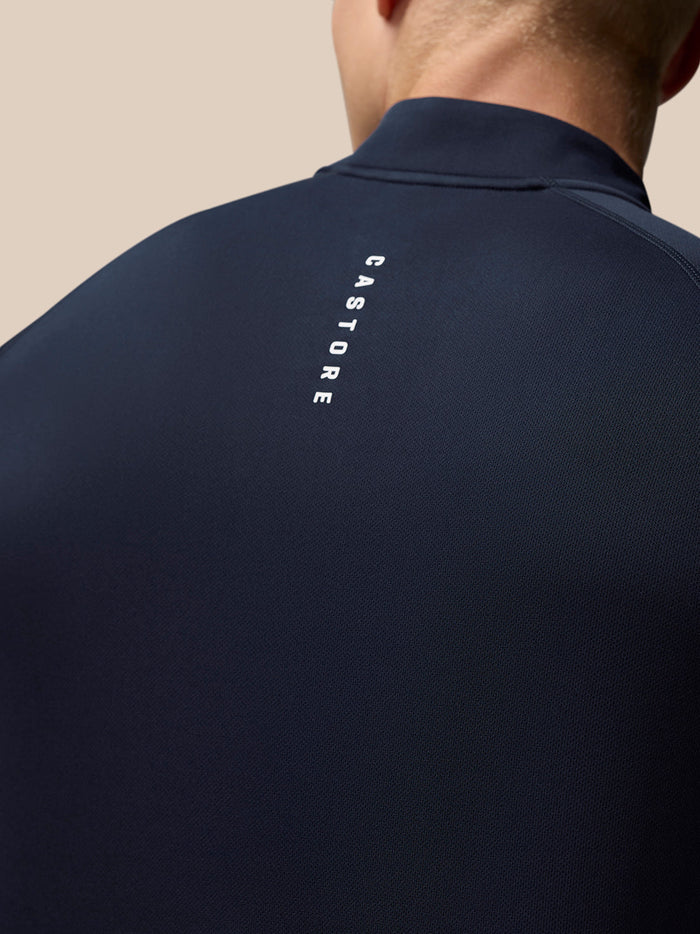 Back view of midnight navy Adapt Training Quarter Zip Top with vertical Castore branding along the upper back