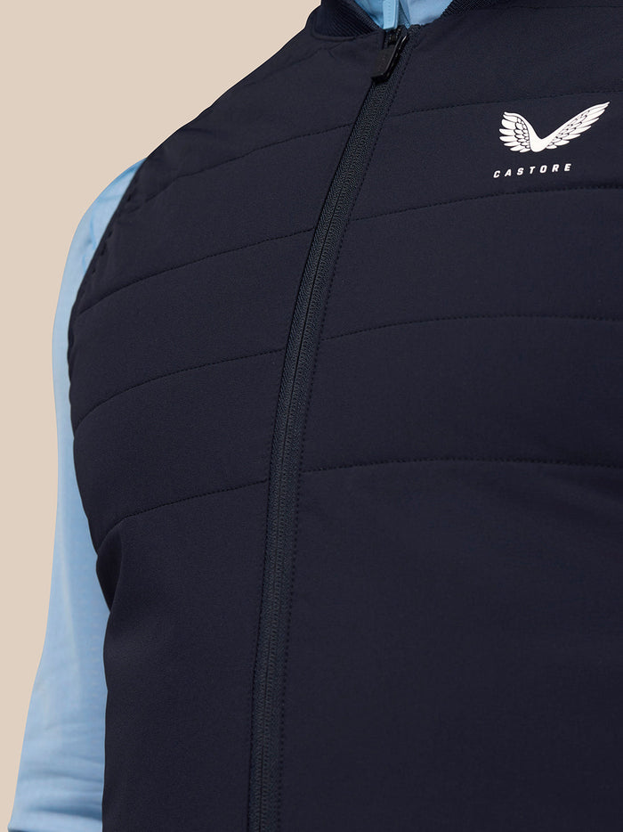 Close-up of navy Apex Training Gilet with front zipper and Castore logo on the chest