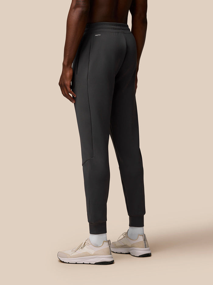Rear view of Charcoal Flex Joggers showing the elasticated waistband and branding on the back