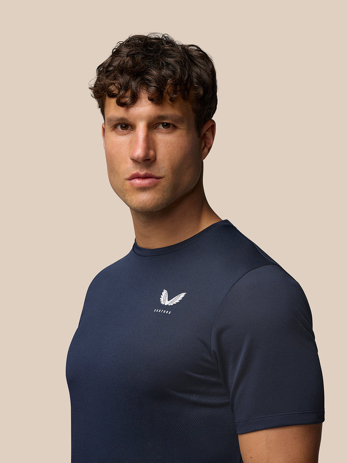 Male model wearing navy Apex Training T Shirt with Castore branding on chest