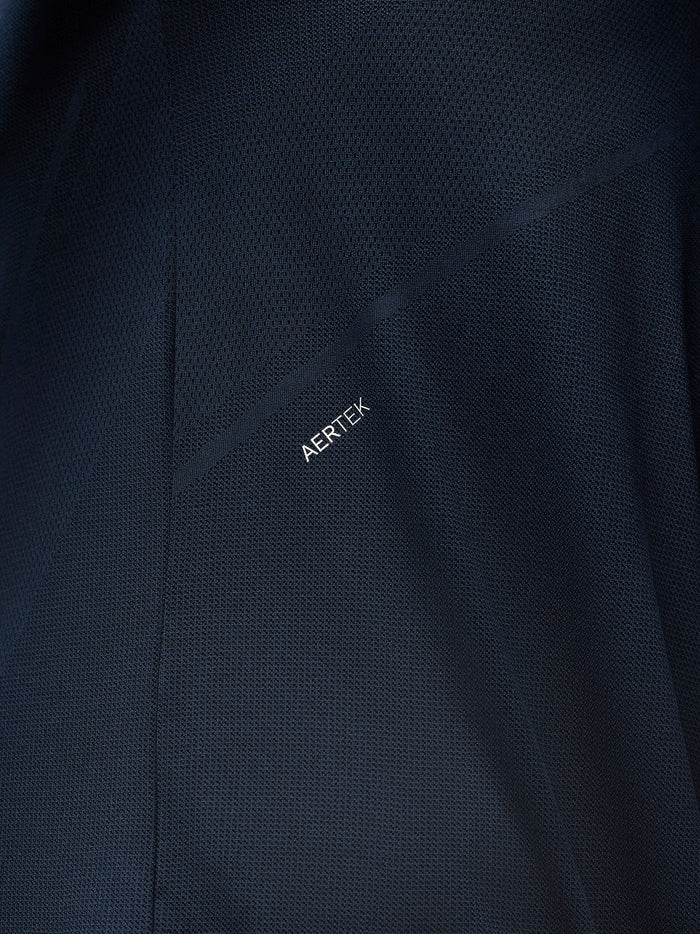 Close-up of navy mesh fabric with AERTEK branding along the seam