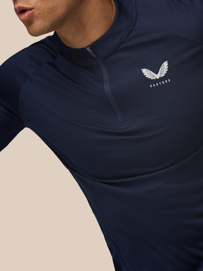 Navy Apex Training Quarter Zip Top close-up showing left chest Castore logo and textured mesh fabric