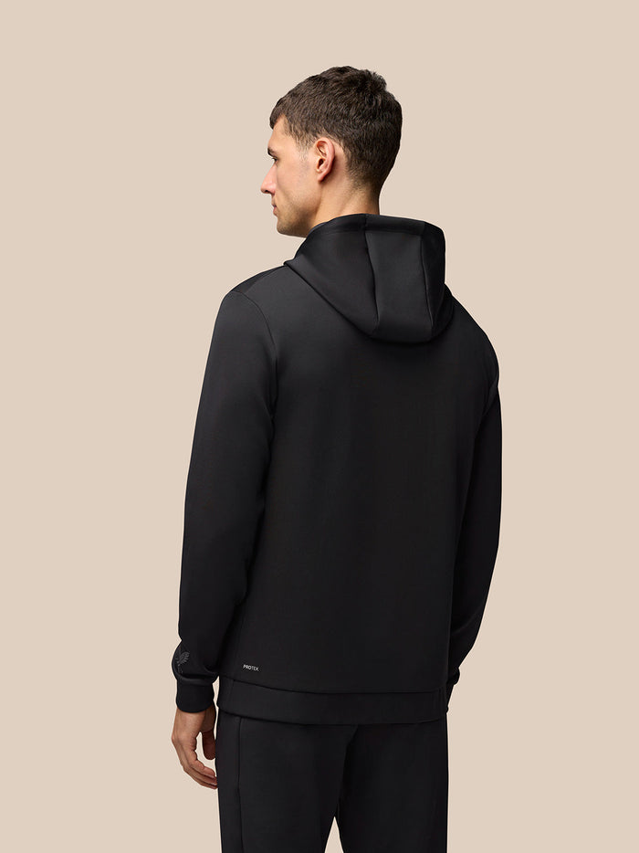 Back view of a man wearing black Flex Hoodie with hood and Protek branding at the lower back