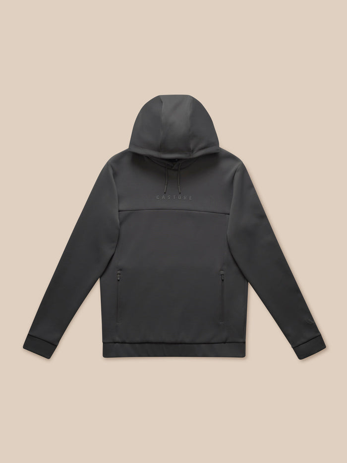 Flat lay of Charcoal Flex Lifestyle Hoodie on a beige background showing the hood, side pockets and Castore branding across the chest.