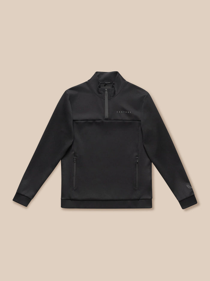 Flat lay of black Castore Flex Lifestyle quarter zip top showing chest logo and zip pockets