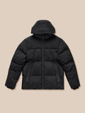 Front view of a black puffer jacket laid flat showing full zip and zipped pockets with Castore branding on chest