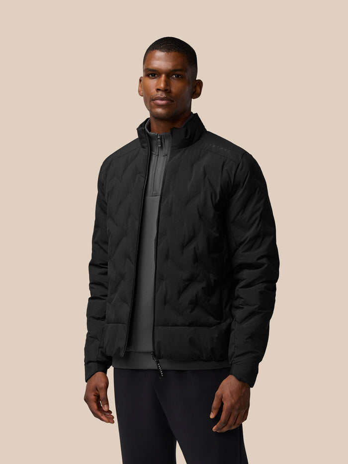 Male model in black padded jacket with zip front and high collar