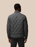 Back view of charcoal quilted jacket with diamond stitch pattern on a model
