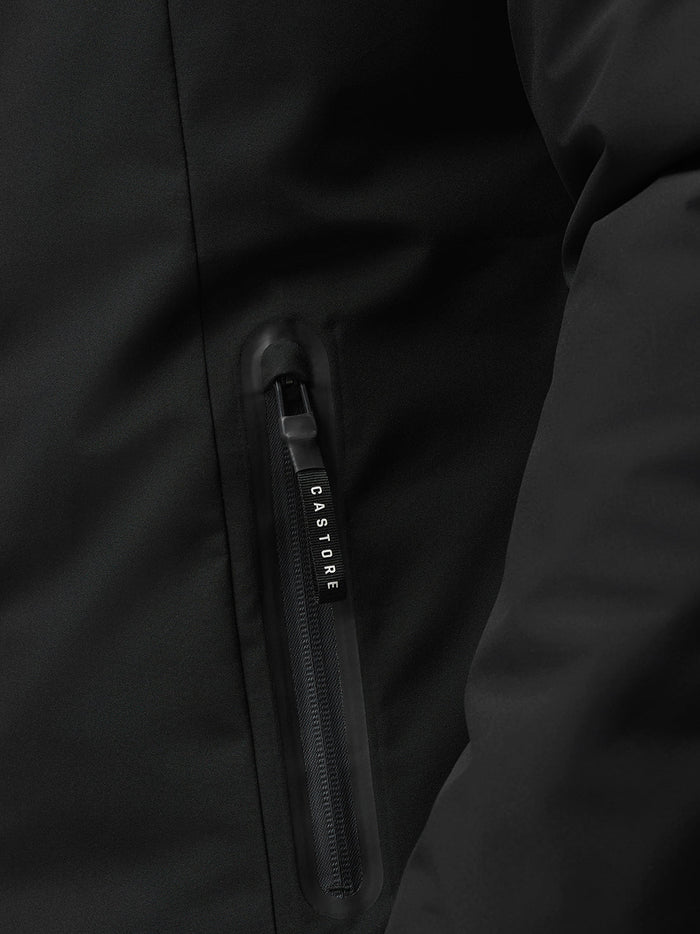 Close up of a black ProTek water resistant jacket showing a vertical zip pocket and CASTORE zipper pull