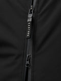 Close-up of a black Castore jacket zipper with branded pull tab against smooth fabric