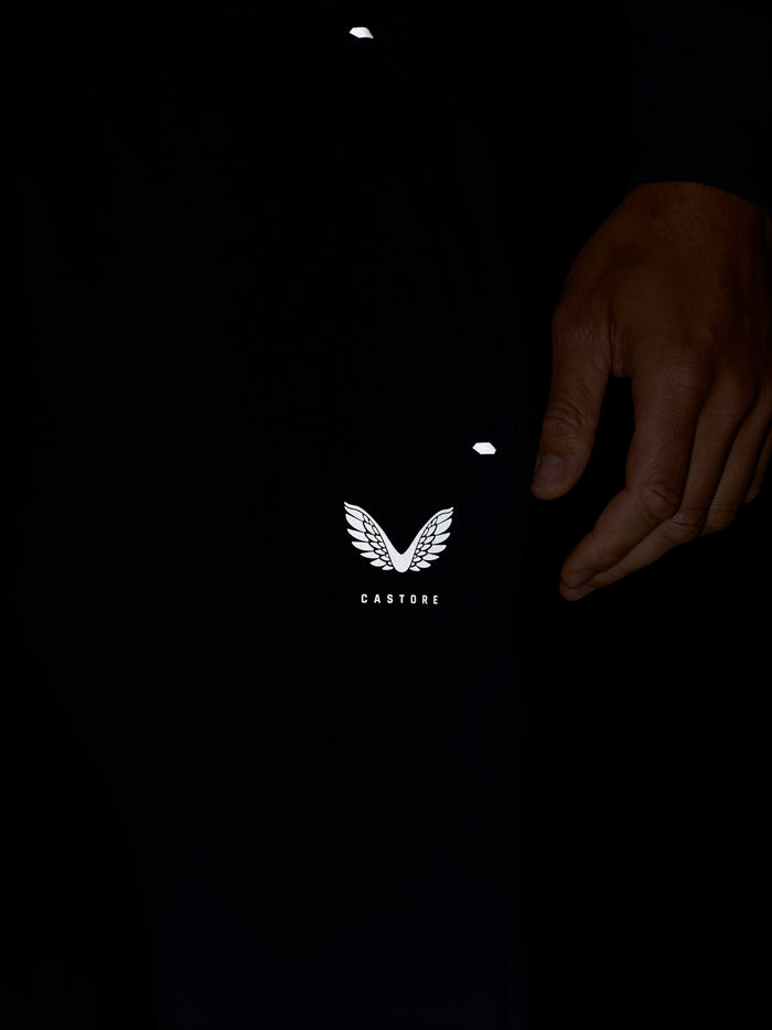 Navy Travel Joggers close-up showing Castore logo on the front leg.