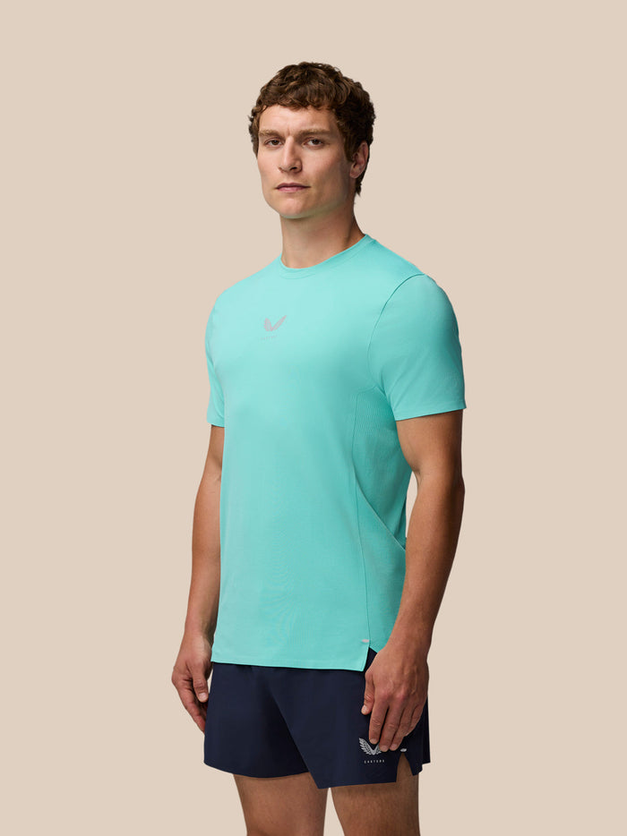 Male model in Light Aqua Zone Training T-Shirt and navy shorts poses for product shot