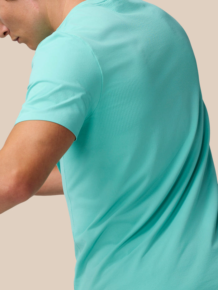 Light Aqua Zone Training T-Shirt shown from back with ribbed panels for mobility