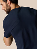 Close-up of midnight navy Zone Training T-Shirt fabric with ribbed shoulder panels.