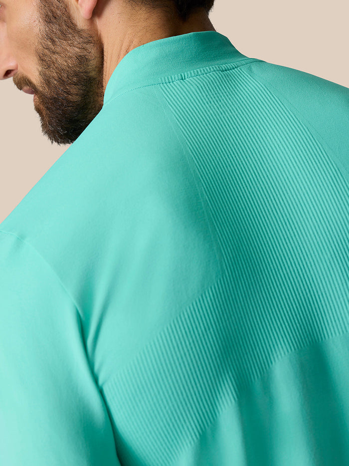 Back shoulder close-up of Zone Training top in Light Aqua highlighting ribbed panel.