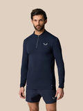 Male model in midnight navy Zone Training 1/4 Zip Top with long sleeves and high neck.