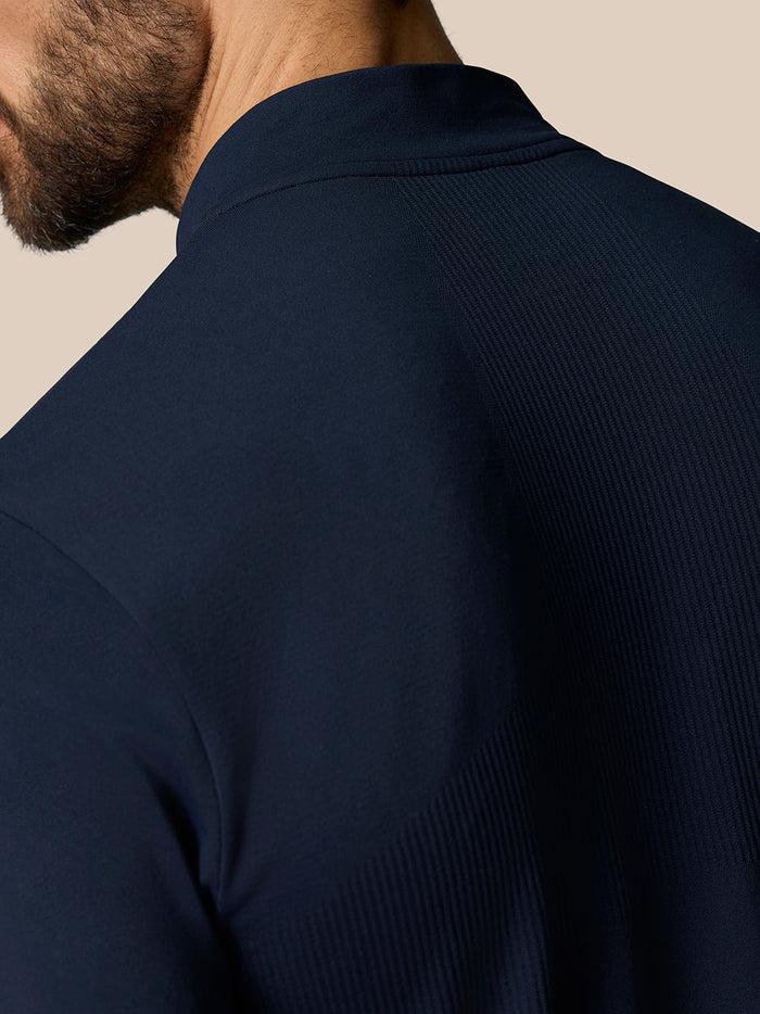 Shoulder close up of navy Zone Training top highlighting ribbed knit panels.