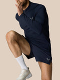 Athlete wearing Zone Training 1/4 Zip Top in Midnight Navy with high neck and zip closure