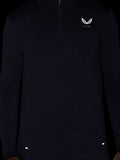 Black long sleeve top with quarter zip and small white wing logo on chest