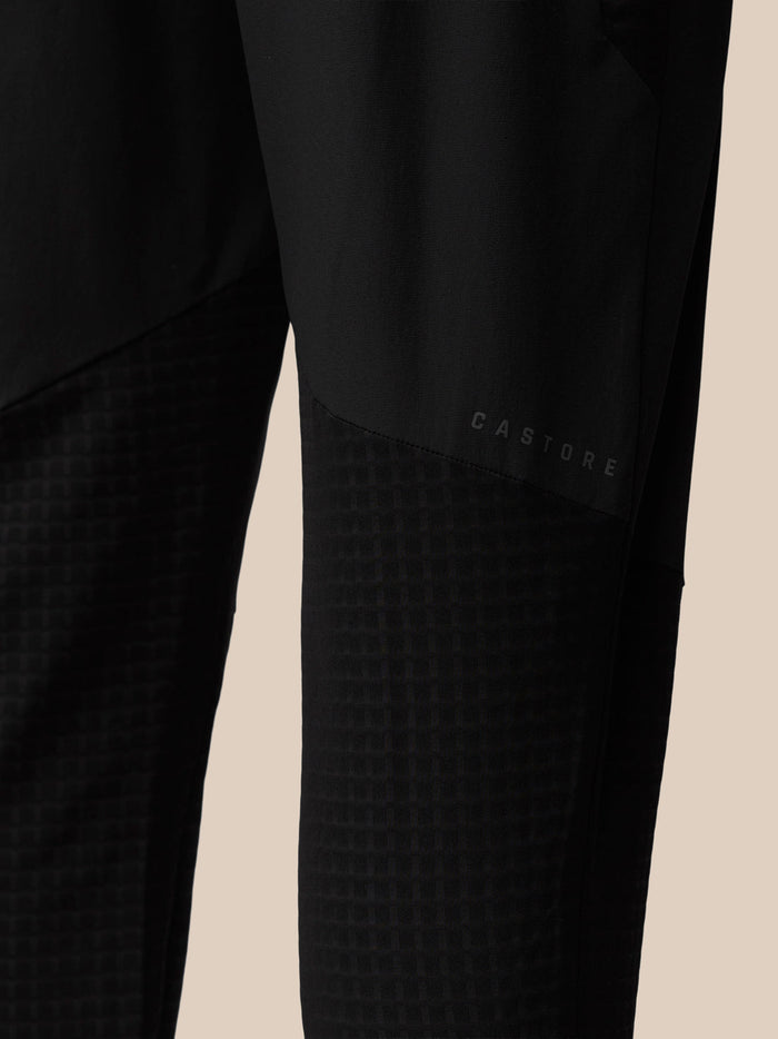 Lower leg of black Flex Winterised Joggers featuring Castore branding and a checkered texture