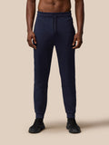 Front view of navy Flex Lifestyle Thermo Pant with drawcord waist and side panel detail.
