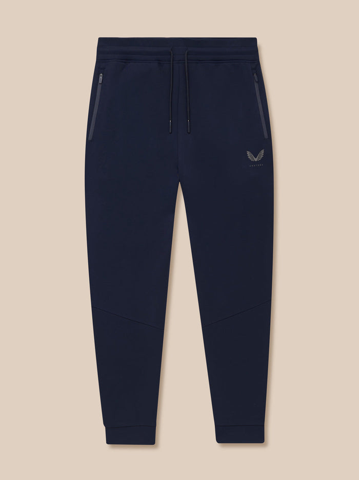 Navy Flex Thermo Pant full view with zip pockets drawstring waist and Castore logo on left leg.