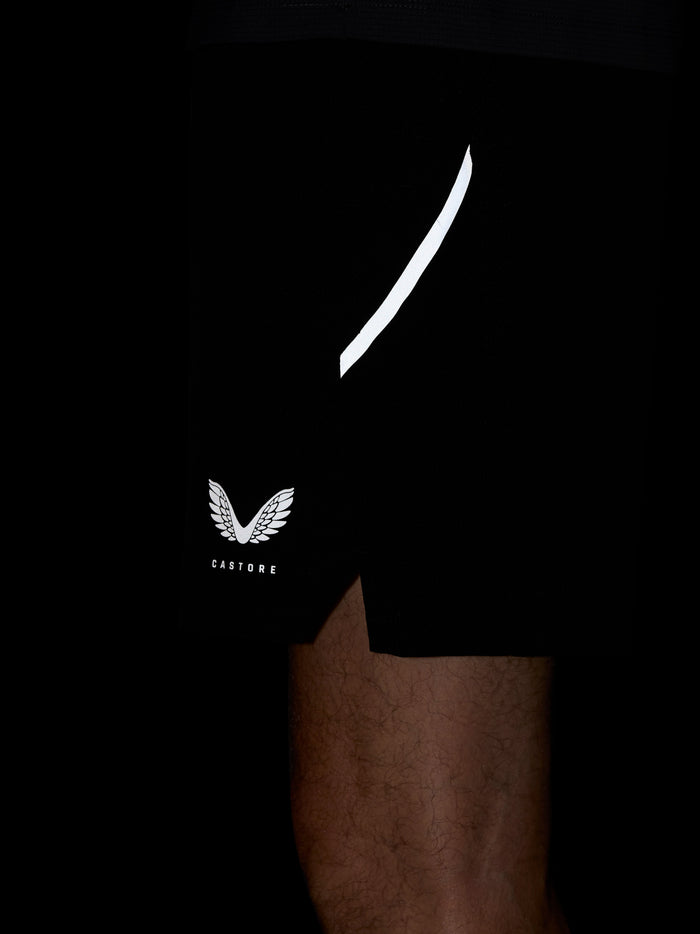 Close up of black Apex Training 6in shorts featuring a white curved stripe and Castore logo on the left leg.
