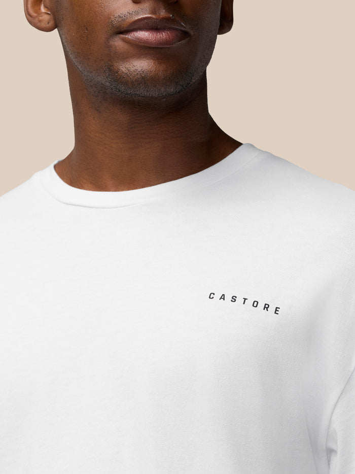 Close-up of white Flex Cotton T-shirt showing the black Castore logo on the chest