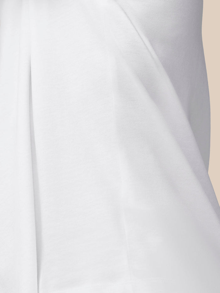 Close-up of white cotton knit fabric with seam detail from the Flex T-shirt