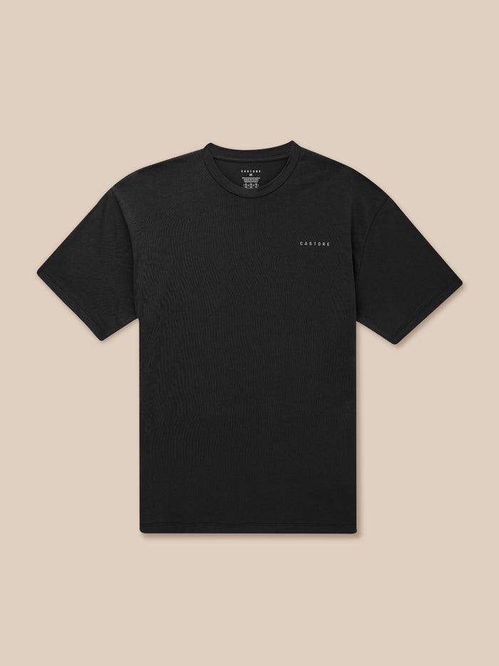 Front view of black Flex Cotton T Shirt with round neckline on a tan backdrop