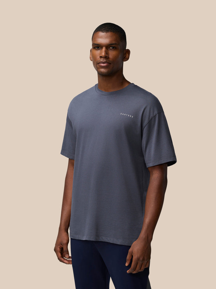 Male model in pewter gray T shirt with small Castore logo on the chest front view