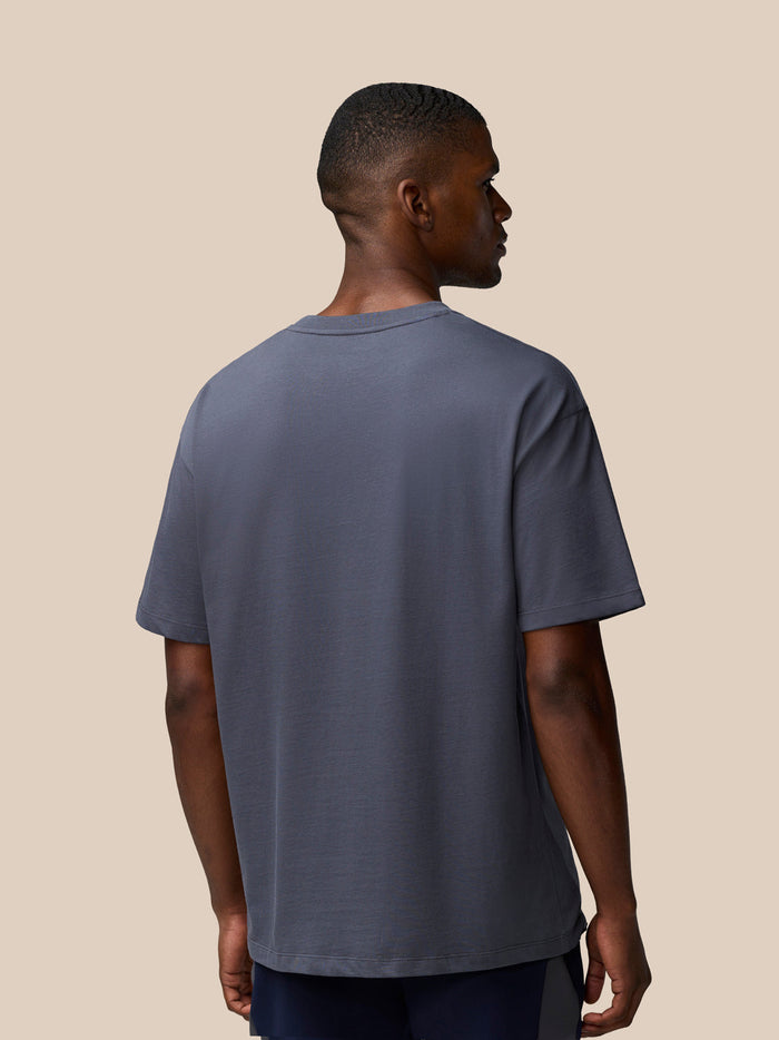 Back view of a man wearing a pewter gray Flex Cotton T Shirt with a round neckline