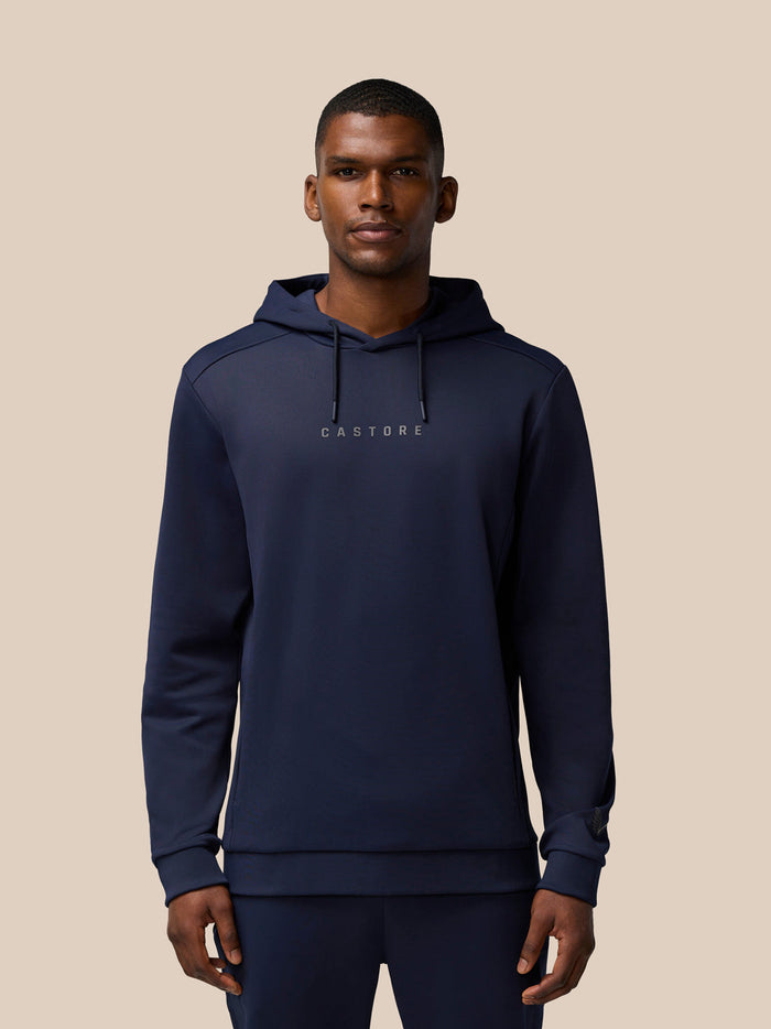Front view of navy Flex Thermo Hoodie showing Castore wordmark at centre chest and hood drawcords