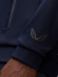 Close up of navy hoodie sleeve featuring Castore logo on the left cuff.
