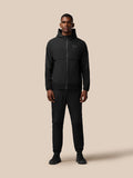 Three quarter rear view of black Flex Winterised Woven Jacket, hood down, highlighting textured lower sleeves.