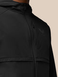Close-up of chest area with a vertical zip pocket and Castore logo on the left chest
