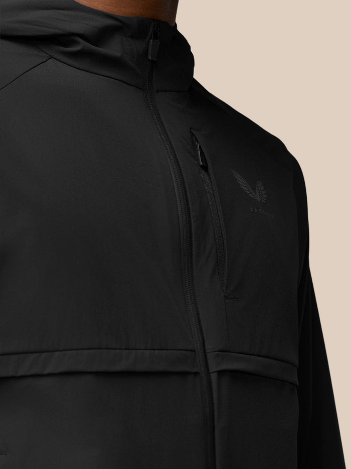 Close-up of chest area with a vertical zip pocket and Castore logo on the left chest
