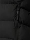 Close-up of a vertical zipper on a black padded gilet with quilted panels.