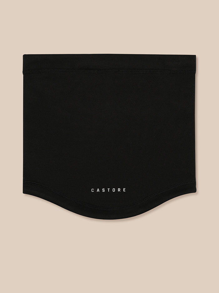 Black snood folded flat with Castore branding on a beige backdrop