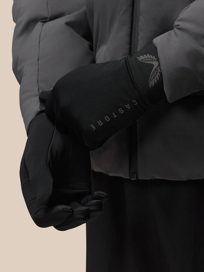 Close up of black Active Gloves with reflective Castore word mark and wings on the cuff