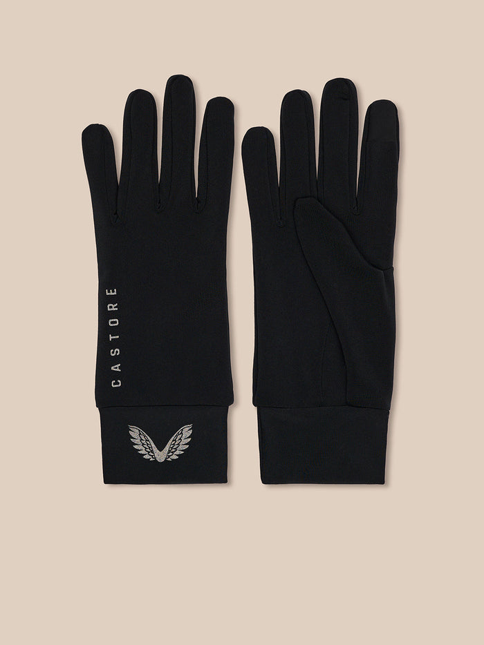 Flat lay of black Castore Core gloves with silver wing logo on the cuff and CASTORE lettering along the wrist