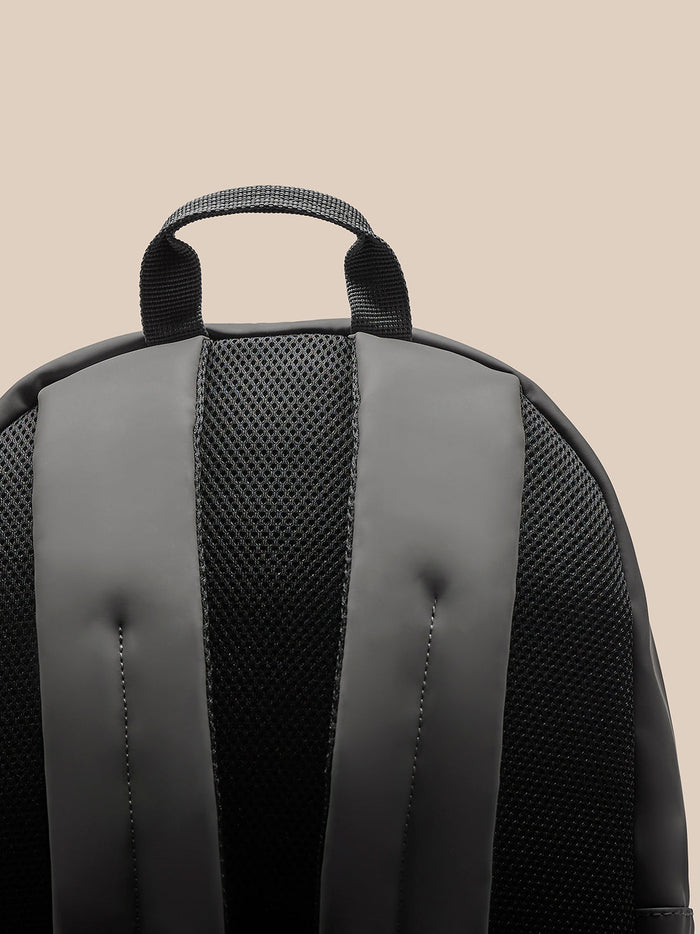 Back view of charcoal backpack with padded shoulder straps and mesh back panel