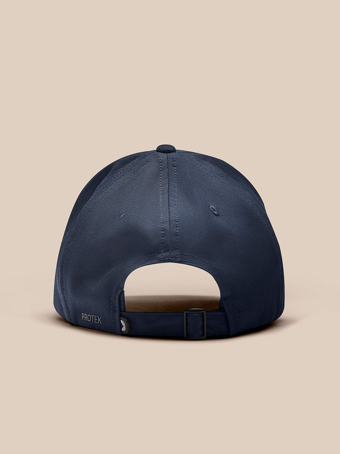 Back view of navy cap with adjustable strap and buckle closure